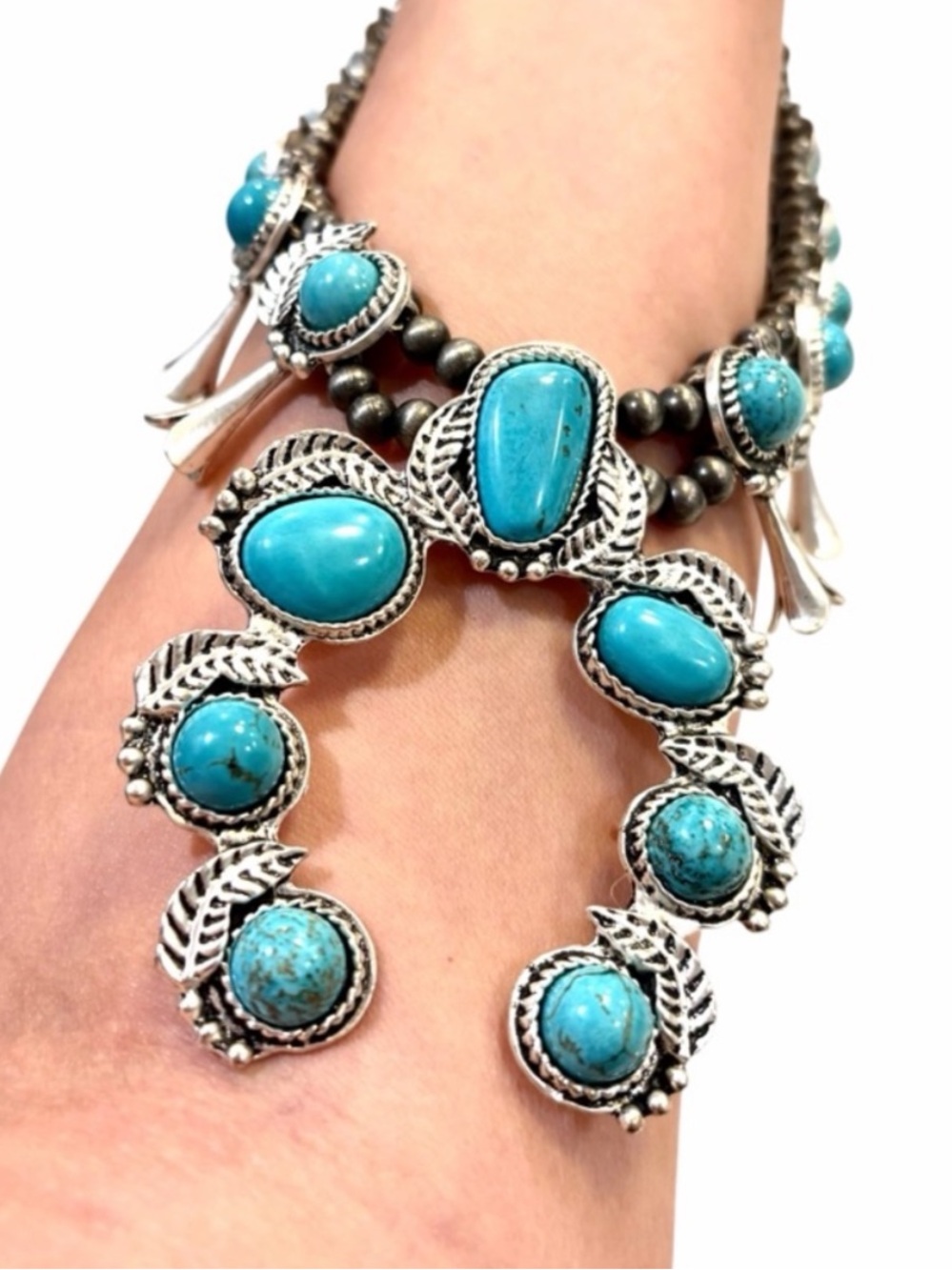 Squash Blossom Navajo Style
Faux Turquoise Silver Tone
Necklace non magnetic - Picture 3 of 12